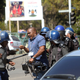 A cameraman is assaulted by police during demonstrations in Harare on Aug. 3, 2016.